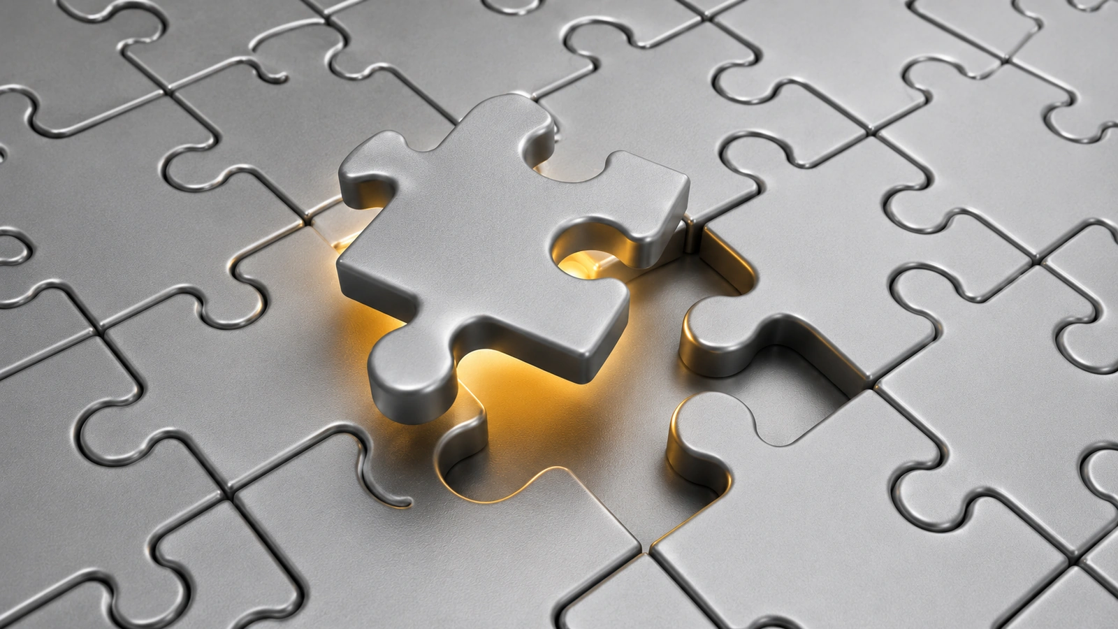 Gray puzzle piece fitting into a lit gap